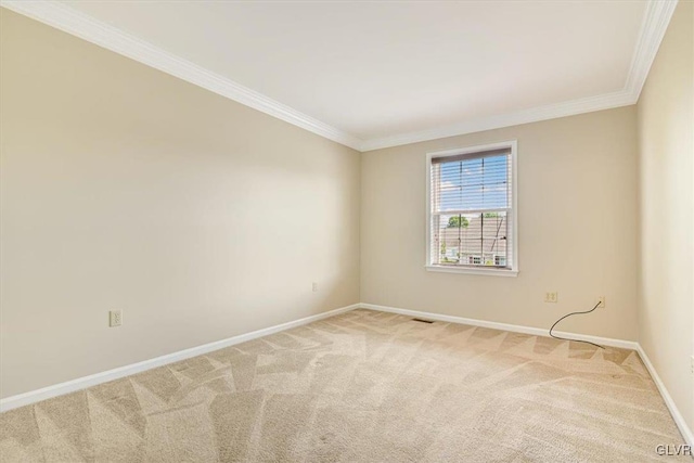 carpeted empty room with crown molding