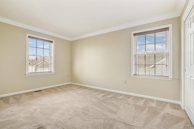 carpeted empty room with ornamental molding