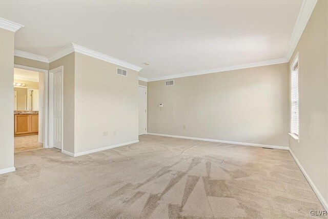 unfurnished room with light carpet and ornamental molding