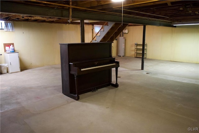 unfinished below grade area with water heater and stairs