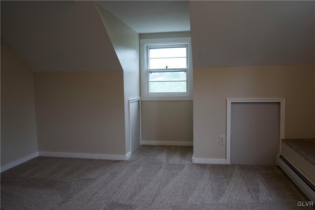 bonus room with a baseboard radiator, carpet flooring, lofted ceiling, and baseboards