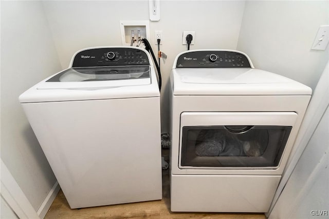 laundry area with washing machine and dryer