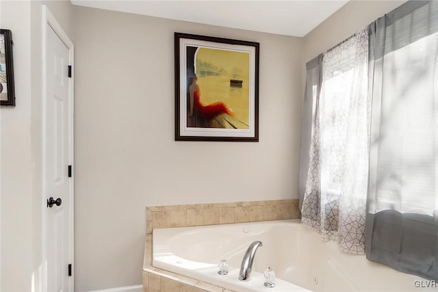 bathroom with tiled tub