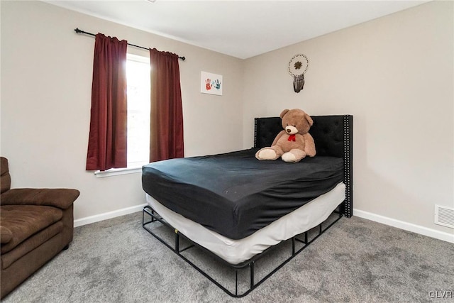 bedroom featuring carpet flooring and multiple windows