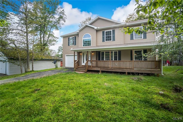 view of front of property featuring a porch, a garage, and a front lawn