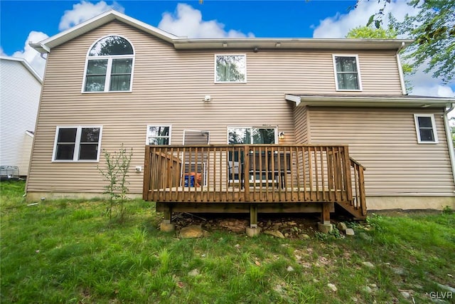 back of property featuring a wooden deck