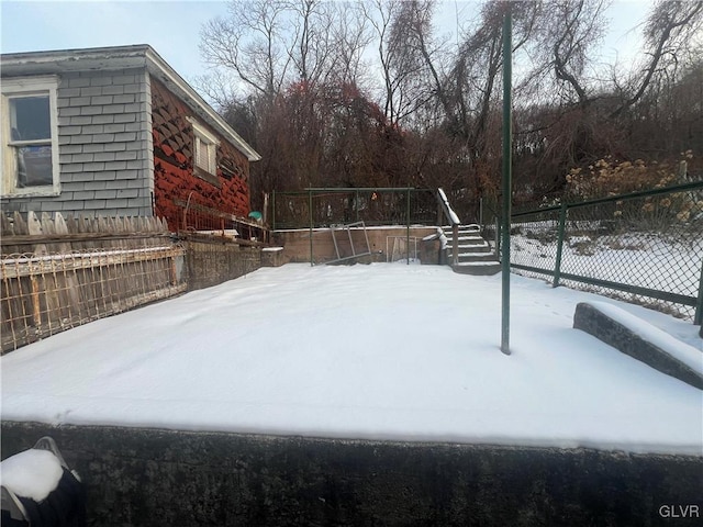 view of yard layered in snow