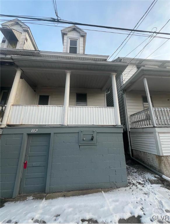 view of snowy exterior with a balcony