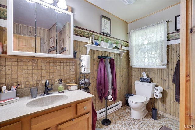 bathroom featuring decorative backsplash, vanity, a baseboard radiator, toilet, and wood walls