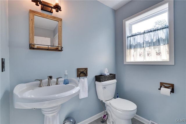 bathroom with toilet and sink