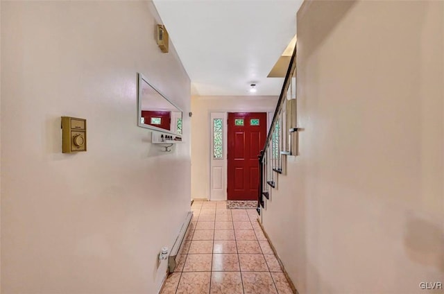 doorway to outside featuring light tile patterned floors