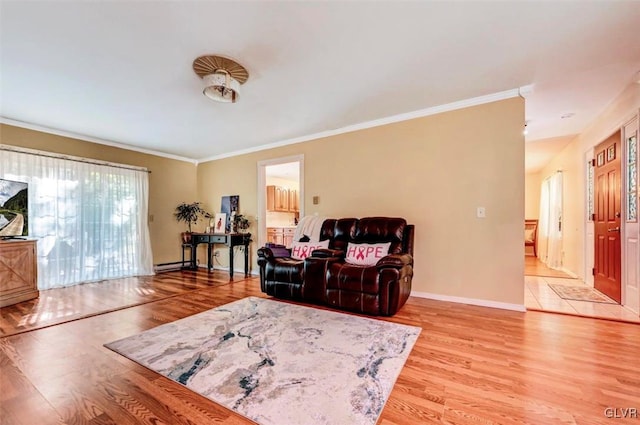 living room with light wood-type flooring, ornamental molding, and a baseboard heating unit