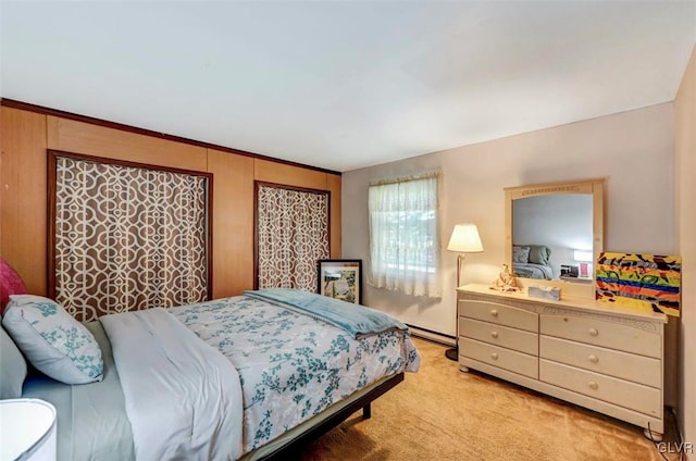 bedroom featuring light colored carpet, ornamental molding, and a baseboard radiator