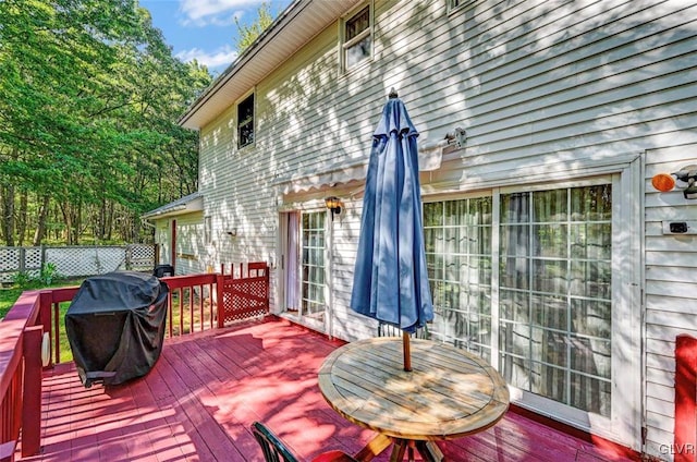 wooden deck with area for grilling