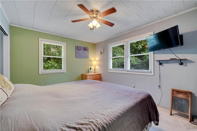 bedroom with ceiling fan and carpet floors