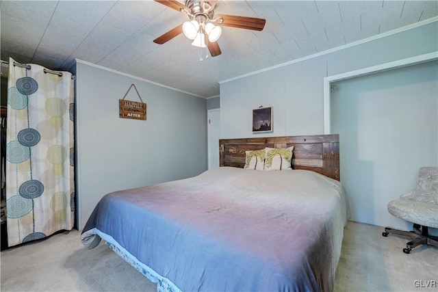 carpeted bedroom with ornamental molding and ceiling fan