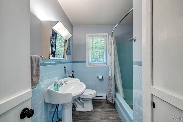 bathroom featuring a baseboard radiator, hardwood / wood-style floors, tile walls, shower / bath combo with shower curtain, and toilet