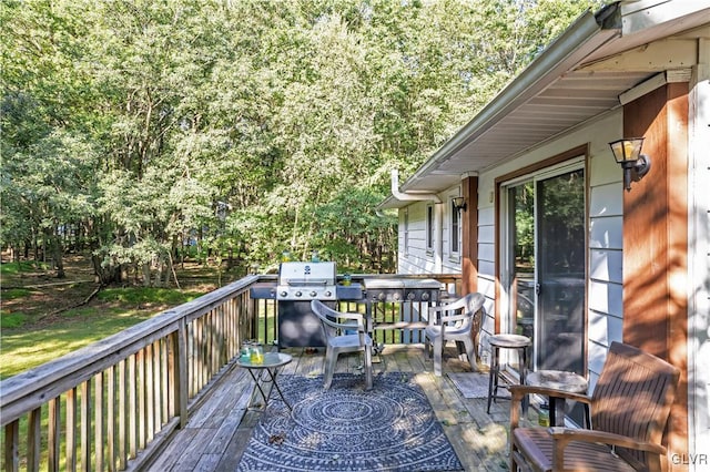 wooden terrace featuring grilling area