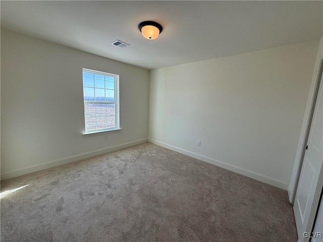 unfurnished room featuring carpet