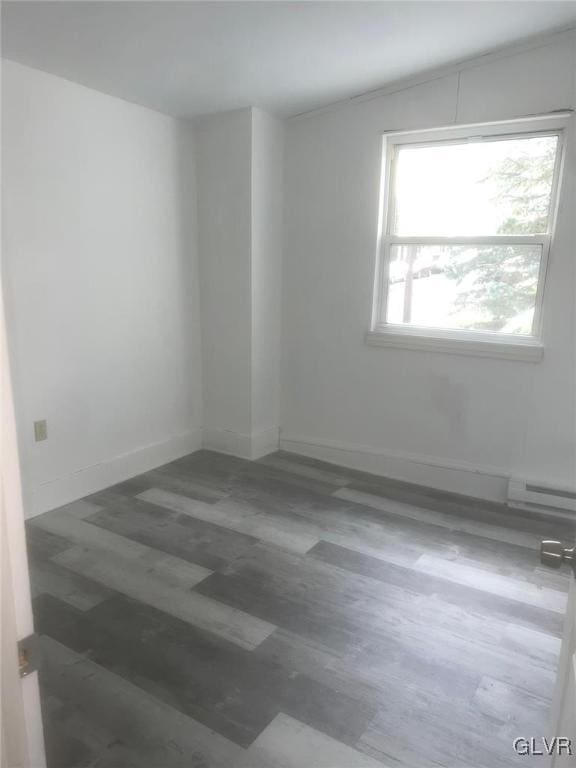 spare room with a baseboard heating unit