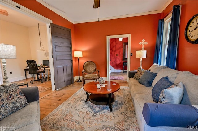 living room featuring light hardwood / wood-style floors and crown molding