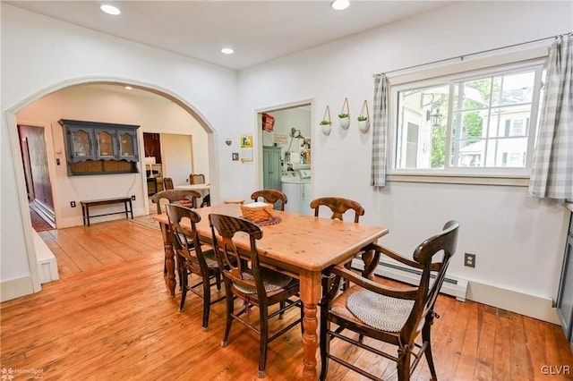 dining room featuring light hardwood / wood-style flooring and a baseboard radiator