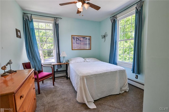 carpeted bedroom with multiple windows and a baseboard radiator