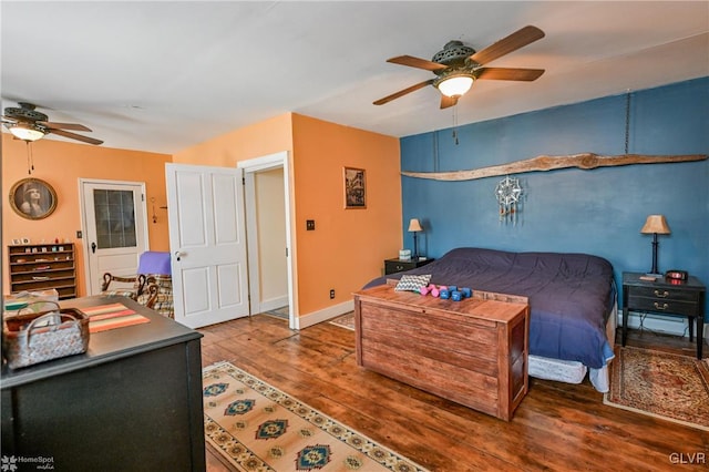 bedroom with ceiling fan and wood-type flooring