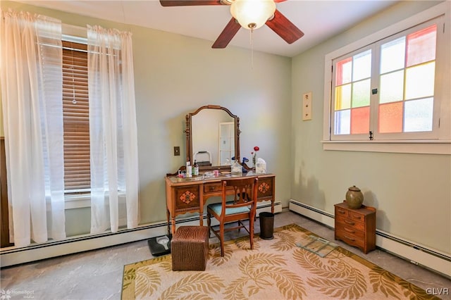 office space featuring ceiling fan and baseboard heating