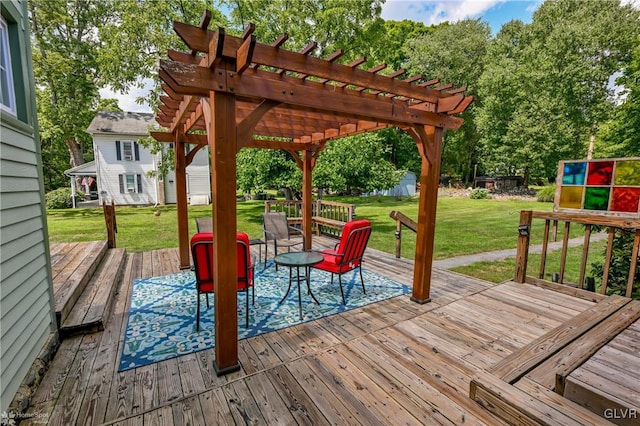 wooden deck with a pergola and a yard