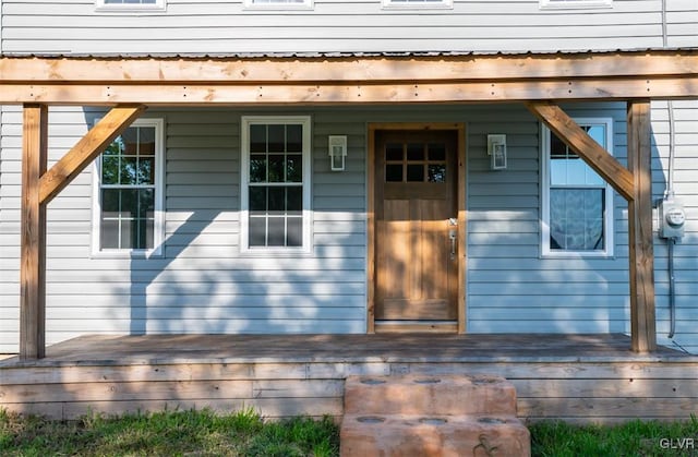 property entrance with a deck