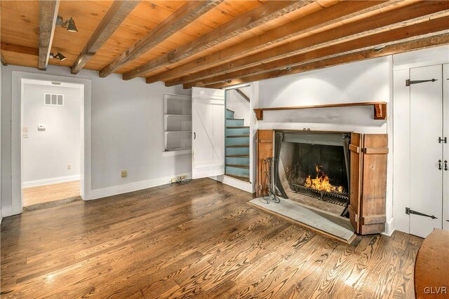 unfurnished living room featuring beam ceiling, wooden ceiling, and wood-type flooring