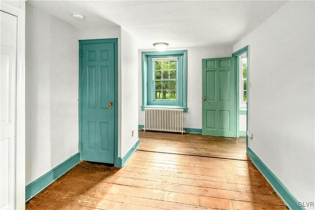 entrance foyer with hardwood / wood-style flooring and radiator