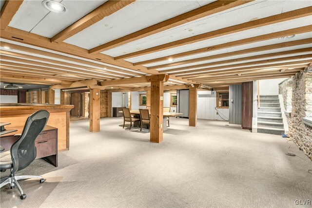 interior space featuring light carpet and beam ceiling