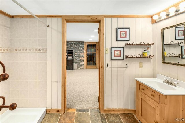 bathroom featuring a shower, vanity, and tile patterned floors