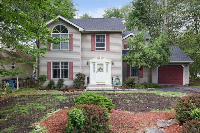 colonial inspired home featuring a garage