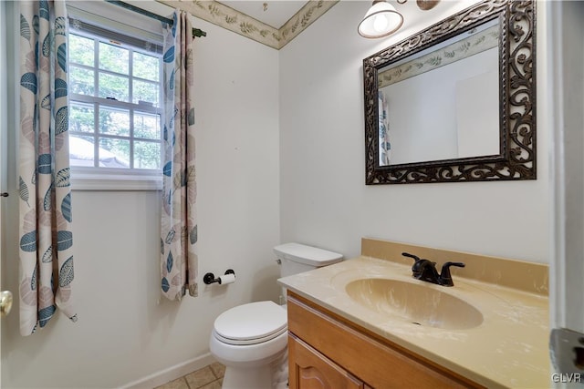 bathroom with tile patterned floors, toilet, and vanity