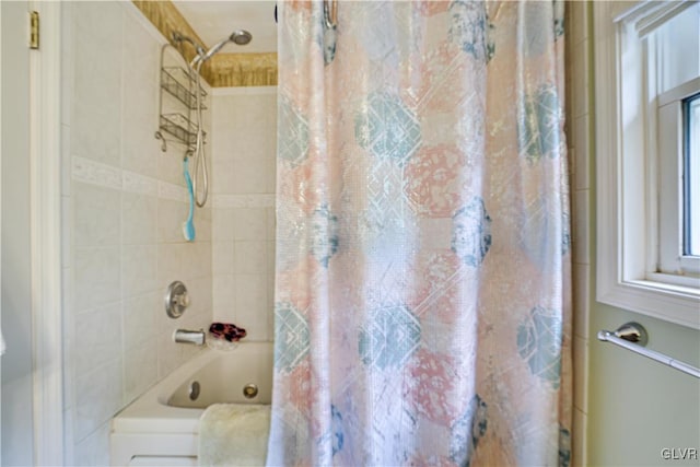 bathroom featuring shower / bathtub combination with curtain