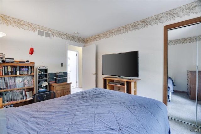 carpeted bedroom featuring a closet