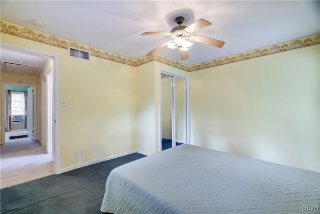 carpeted bedroom featuring ceiling fan and a closet