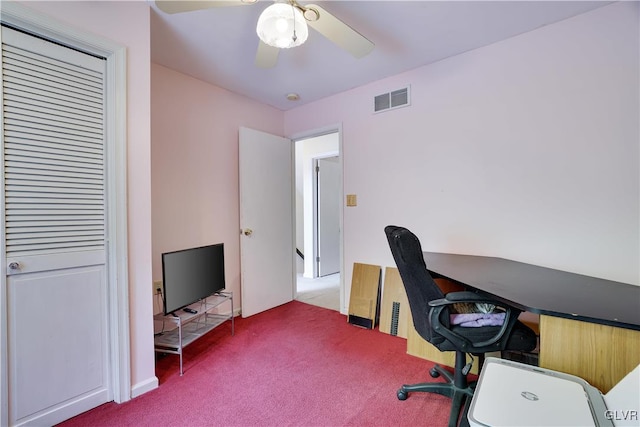 carpeted home office with ceiling fan