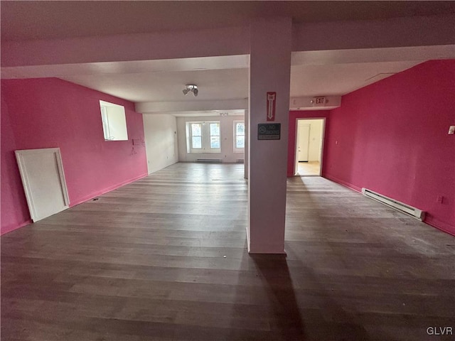 spare room with a baseboard radiator and wood-type flooring