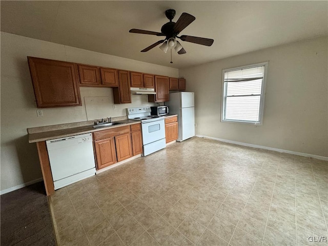 kitchen featuring ceiling fan, sink, light tile patterned flooring, and white appliances