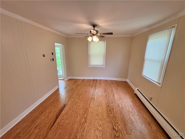 unfurnished room with ceiling fan, crown molding, light hardwood / wood-style flooring, and baseboard heating