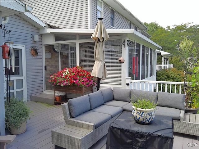 wooden terrace featuring an outdoor hangout area