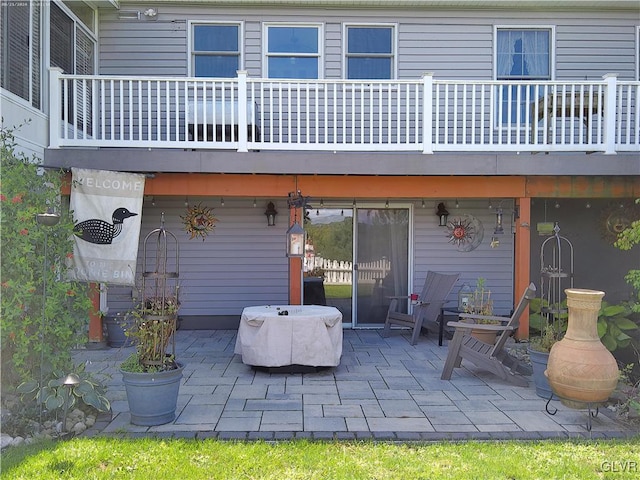 back of property with a patio area and a balcony