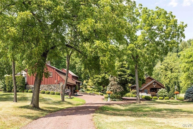 view of home's community with a lawn