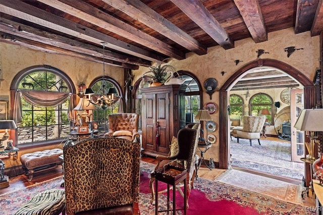 interior space with hardwood / wood-style floors, beam ceiling, and wooden ceiling