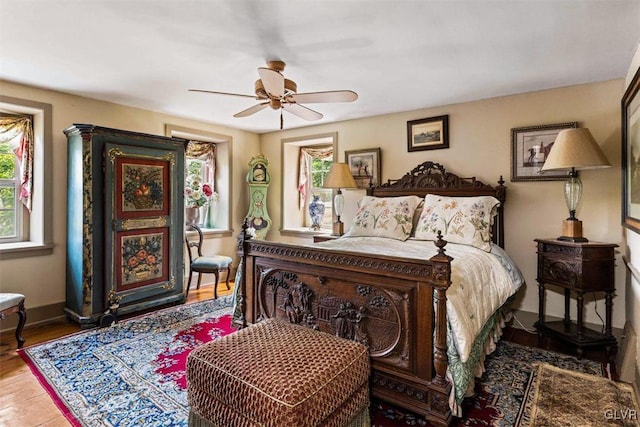 bedroom featuring hardwood / wood-style floors and ceiling fan