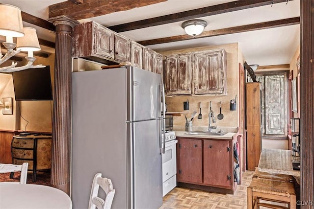 kitchen featuring light parquet floors, sink, white appliances, and beam ceiling